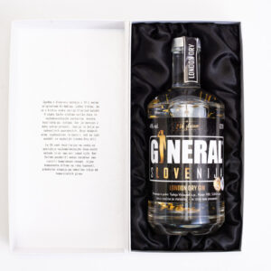 Gin bottle in a white gift box, cushioned by black satin lining, ready as a premium gift set.